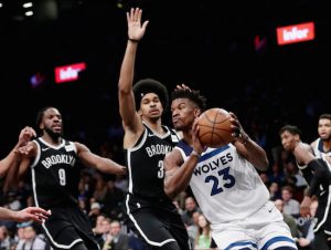 Jimmy Butler, shown here being guarded by Nets center Jarrett Allen, is still in Minnesota as rumors persist that he could be dealt to Brooklyn, Los Angeles, Miami or even to the arch rival New York Knicks. AP Photo by Frank Franklin II
