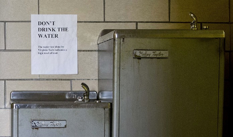 Shown: Signs warn not to drink the lead contaminated water from a water fountain in Flint, Mich. AP file photo by Jacquelyn Martin