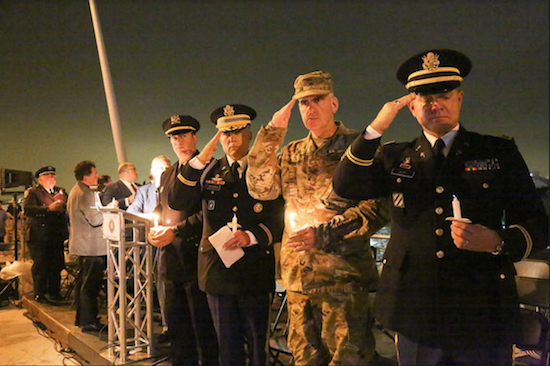 Officials salute during 9/11 remembrance ceremonies held on the 69th Street American Veterans Memorial Pier in Bay Ridge. A similar ceremony was held in Marine Park. Eagle photo by John Calabrese