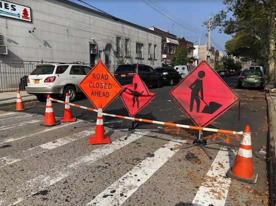 Signs warn drivers to stay off of 80th Street between 17th and 16th avenues on Sept. 6 as repairs crews dealt with a water main break on the street. Eagle photo by Paula Katinas