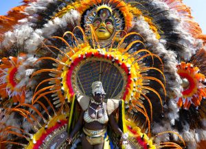 A person moves along the parade route during the West Indian American Day Parade in the Brooklyn borough of New York, on Monday. New York's Caribbean community has held annual Carnival celebrations since the 1920s, first in Harlem and then in Brooklyn, where festivities happen on Labor Day. AP Photo/Craig Ruttle