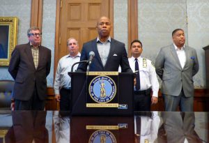 Borough President Eric Adams (at podium) held a press conference on Friday to explain moves the borough is taking in response to a recent spate of gunfire incidents in Downtown Brooklyn. Eagle photos by Mary Frost