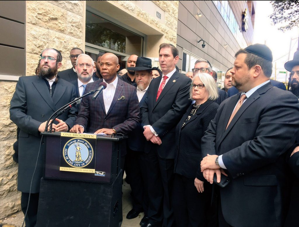 Following Saturday’s horrific attack at a synagogue in Pittsburg on Saturday, Borough President Eric Adams on Sunday urged off-duty police officers to bring their guns with them to religious services. He was joined by the Flatbush Jewish Community Coalition, Councilmember Chaim Deutsch and numerous local leaders at Ohel Bais Ezra, a Jewish family services center in Midwood, home to thousands of Orthodox Jews.  Photo courtesy of the Borough President’s Office