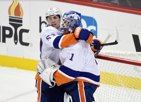 Thomas Greiss gets a hug from Casey Cizikas after the Islanders completed a perfect 3-0-0 road trip against Metropolitan Division opponents with a 6-3 triumph in Pittsburgh on Tuesday night. AP Photo by Don Wright