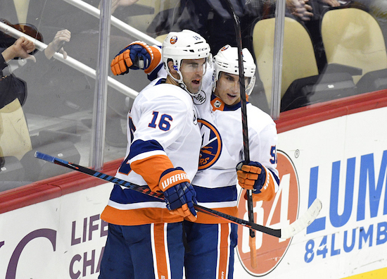 New York Islanders left wing Andrew Ladd (16) celebrates with New York Islanders center Valtteri Filppula (51) after scoring a goal against the Pittsburgh Penguins during the first period of an NHL hockey game in Pittsburgh, Tuesday, Oct. 30, 2018. AP Photo/Don Wright