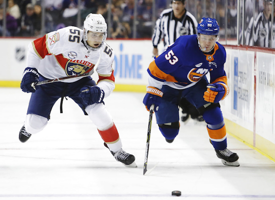 Florida Panthers' Bogdan Kiselevich (55) and New York Islanders' Casey Cizikas (53) skate for the puck during the second period of an NHL hockey game Wednesday, Oct. 24, 2018, in New York. AP Photo/Frank Franklin II