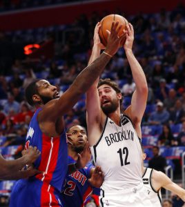 Brooklyn Nets forward Joe Harris (12) is defended by Detroit Pistons center Andre Drummond during the first half of an NBA basketball game, Wednesday, Oct. 17, 2018, in Detroit. AP Photo/Carlos Osorio