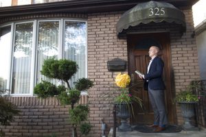 In this Oct. 3 photo, Democratic congressional candidate Max Rose knocks on a door while canvassing in Bay Ridge. Rose is running as a moderate in a district that voted for Donald Trump in 2016 and Barack Obama in 2012. AP Photo/Mary Altaffer