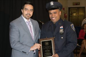 The Kings County Criminal Court held its annual Hispanic Heritage Month celebration on Friday where Judge Edwin Novillo (left) presented court officer Juan Suriel with the Criminal Court Employee of the Year Award. Eagle photos by Rob Abruzzese