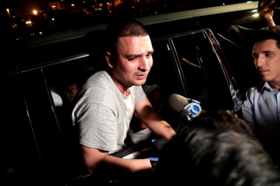 Pablo Villavicencio leans out of an SUV while talking to reporters after being released from the Hudson County Correctional Facility on July 24, 2018, in Kearny, N.J. Villvicencio was arrested on Friday after an alleged physical altercation with his wife. AP Photo/Julio Cortez