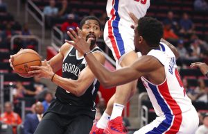 Brooklyn Nets guard Spencer Dinwiddie, left, looks to pass around Detroit Pistons guard Langston Galloway (9) during the first half of an NBA preseason basketball game, Monday, Oct. 8, 2018, in Detroit. AP Photo/Carlos Osorio