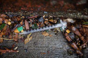 A hypodermic needle is left on the ground outside the Pena Herrera Playground, blocks away from the homeless shelter. Eagle photos by Paul Frangipane