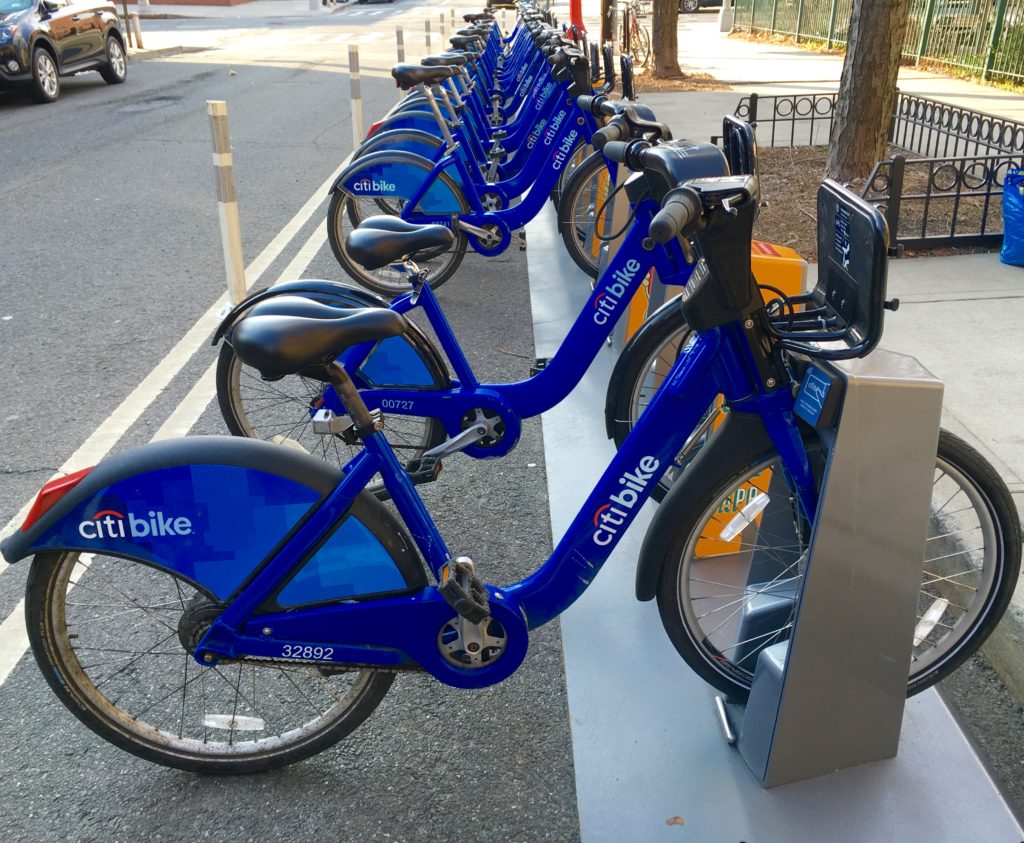 Citi Bikes are seen docked at a station at Carroll Street on the corner of Columbia Street this past March. NYC plans to triple the number of Citi Bike bicycles and expand the program’s territory by 35 square miles. Eagle photo by Lore Croghan