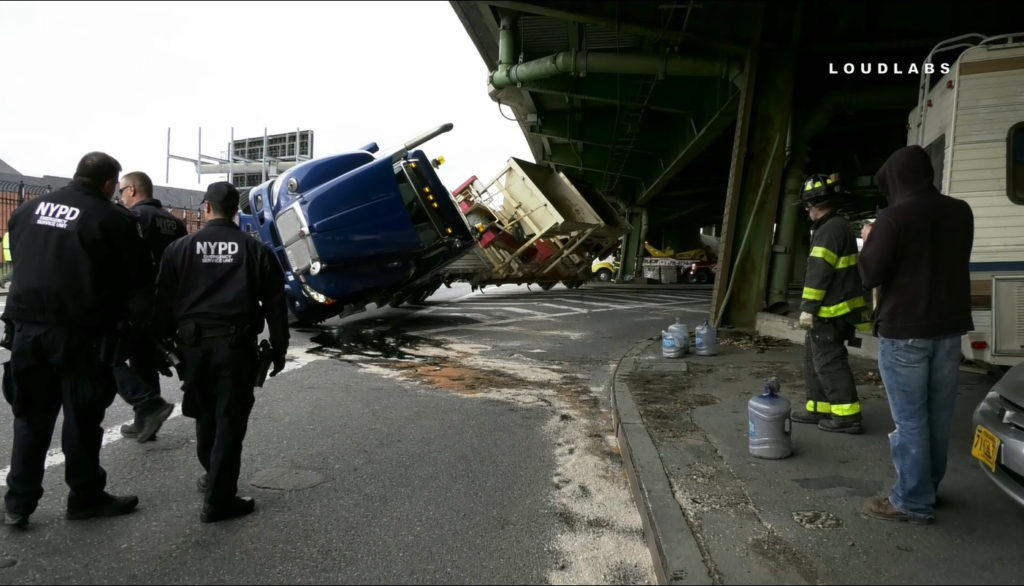 A tractor trailer overturned under the Gowanus at 18th Street on Tuesday afternoon. Photo by Loudlabs News NYC