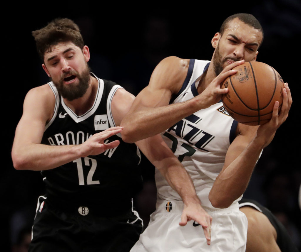 Rudy Gobert wrestles the ball away from the Nets’ Joe Harris during Brooklyn’s latest fourth-quarter collapse Wednesday night at Downtown’s Barclays Center. AP Photo by Julio Cortez