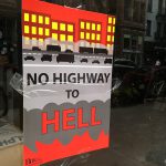 On Wednesday, the Brooklyn Heights Association distributed glossy signs reading “Fix the BQE Plan” on one side and a fiery “No Highway to Hell” on the flip side. The signs began to appear on windows across the north Heights the next day.  Eagle photo by Mary Frost