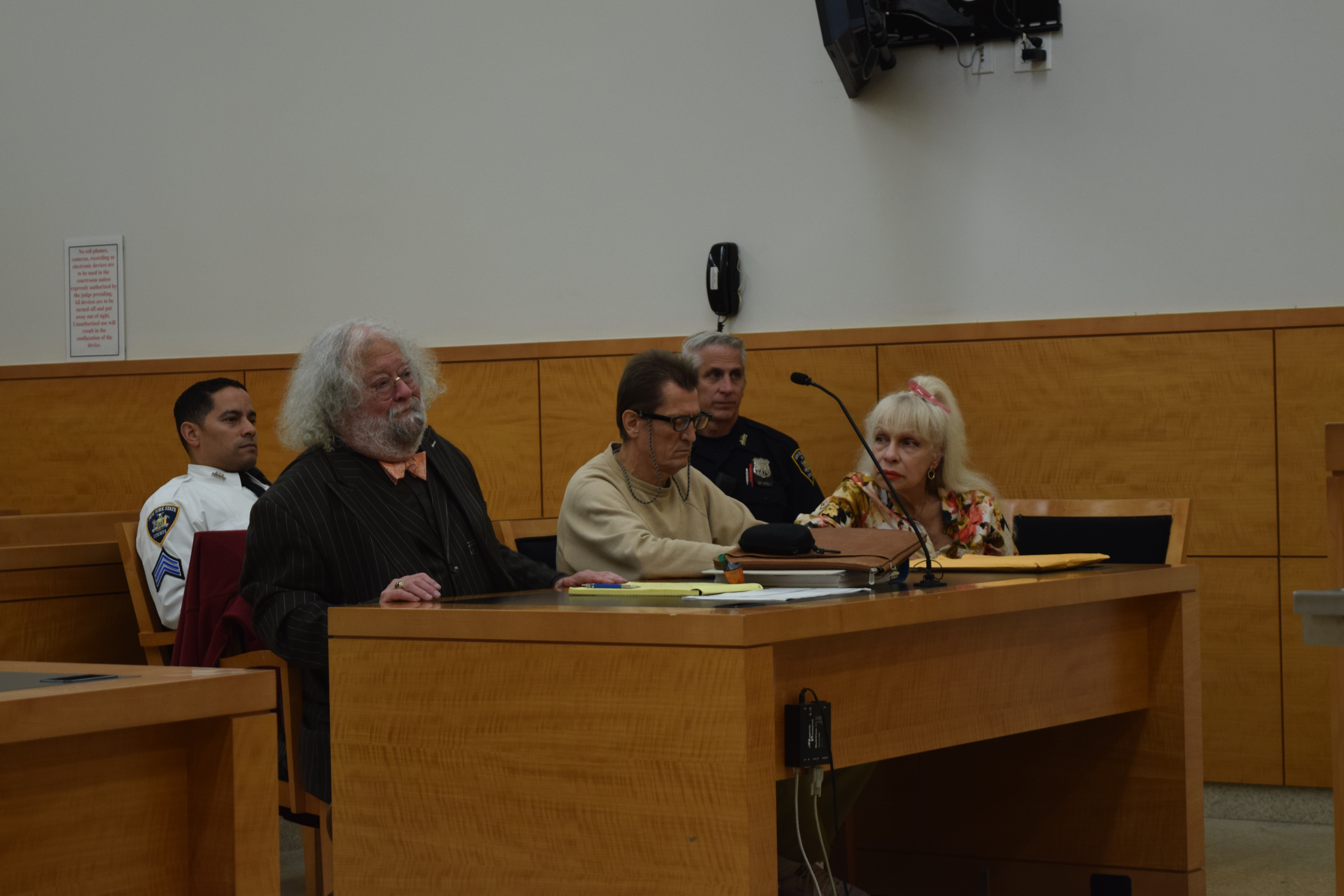 Valeriy Milonovich (center) appears in Brooklyn Supreme Court on Nov. 8 with his attorney Steven Chaikin (left) and a Russian interpreter. Eagle photo by Christina Carrega