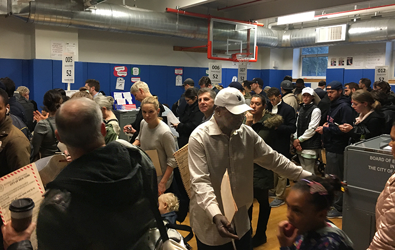 Unprecedented voter turnout combined with malfunctioning ballot scanners caused frustration and havoc at polling sites across Brooklyn for Tuesday’s midterm election. Shown above: Voters at P.S. 8 in Brooklyn Height were “packed wall to wall and everyone is grumpy.” Eagle photo by Sara Bosworth