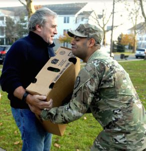 Members of the Salaam Club of New York help distribute turkeys to the service members at Fort Hamilton Army Base. Photo by Arthur de Gaeta