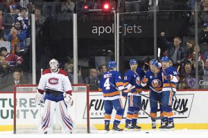 Montreal Canadiens goaltender Antti Niemi, left, reacts as New York Islanders center Valtteri Filppula (51) celebrates after scoring a goal with his teammates in the first period of an NHL hockey game, Monday, Nov. 5, 2018, in New York. AP Photo/Mary Altaffer