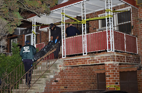 Police take out the body of Petrina Masotto from her 26th Avenue home. Eagle photo by Mark Mellone