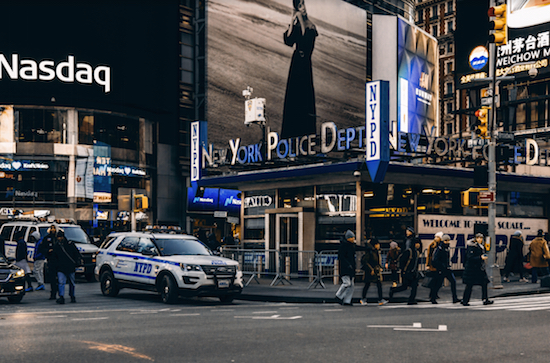 NYPD station in Times Square. Photo by Meric Dağli courtesy of Unsplash