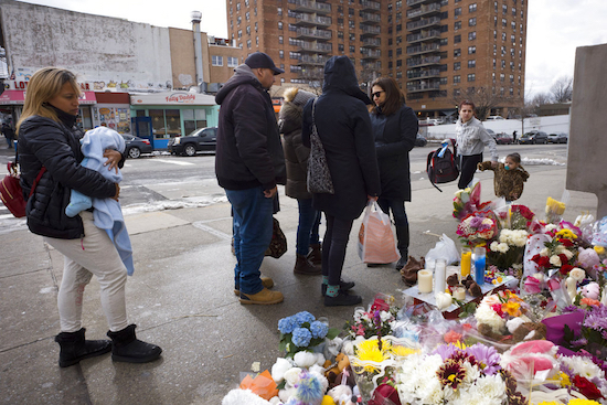 In this March 8, 2018 file photo, people gather at a sidewalk memorial for two children who were killed the previous week in Park Slope. The woman who drove the car died of an apparent suicide on Tueday. AP file photo