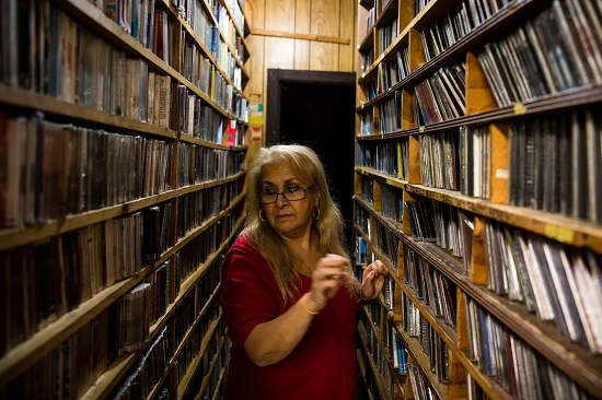 Owner of S.A.S. Italian Records Silvana Conte looks through thousands of CD’s worth of Italian music. Eagle photos by Paul Frangipane