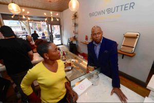 Getting ahead of tomorrow’s Small Business Saturday, Borough President Eric Adams spent Tuesday visiting black-owned cafes, part of his #BLKCoffeeInBK campaign. Here, he visits Brown Butter Craft Bar & Kitchen, owned by Myriam Nicolas (left). Eagle photo by Todd Maisel