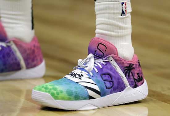 Brooklyn Nets' Spencer Dinwiddie wears shoes as a tribute to Miami Heat's Dwyane Wade during the second half of an NBA basketball game against the Miami Heat, Tuesday, Nov. 20, 2018, in Miami. The Nets won 104-92. This is Wade's last season. AP Photo/Lynne Sladky