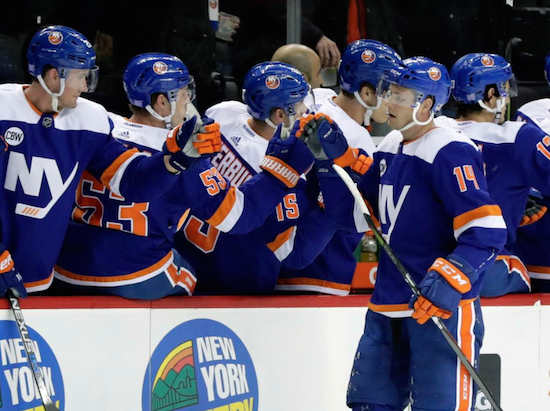 Tom Kuhnhackl receives congratulations from his teammates on the bench Tuesday night at Barclays Center after his first career two-goal game lifted the Islanders to a 5-2 victory over Vancouver. AP Photo by Frank Franklin II
