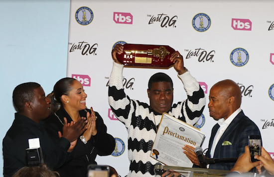 Comedian Tracy Morgan holds the Key to Brooklyn aloft while his wife, Megan Wollover, and son, Tracy Jr., applaud. Borough President Eric Adams reads from the accompanying proclamation. Eagle photo by Andy Katz
