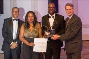 Chief Clerk Charles Small (second from right) was one of four honorees at the Tribune Society's 50th anniversary dinner. Pictured from left: Roderick Randall, Hon. Sylvia Hinds-Radix, Charles Small and Hon. Lawrence Knipel, administrative judge of the Brooklyn Supreme Court, Civil Term. Photos courtesy of the Tribune Society