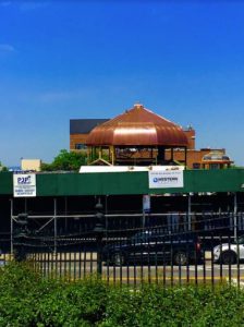 That's the Weir Greenhouse's new copper dome peeking over a construction fence. Eagle file photo by Lore Croghan