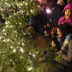 Amy Joyce watches the tree lighting with her kids, Winnie and Taylor.