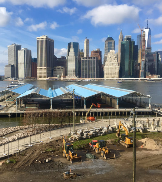 Here's Brooklyn Bridge Park's Pier 2 play area with its distinctive blue roof, as seen from the Promenade.