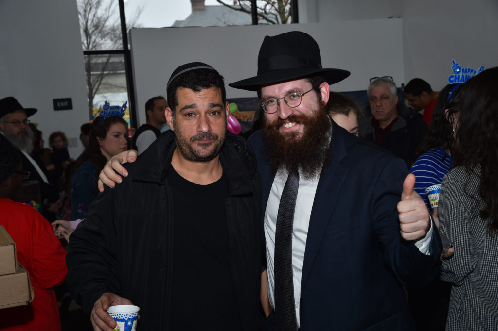 An attendee with Rabbi Yehuda Levin. Photos courtesy of Central Brooklyn Chabad