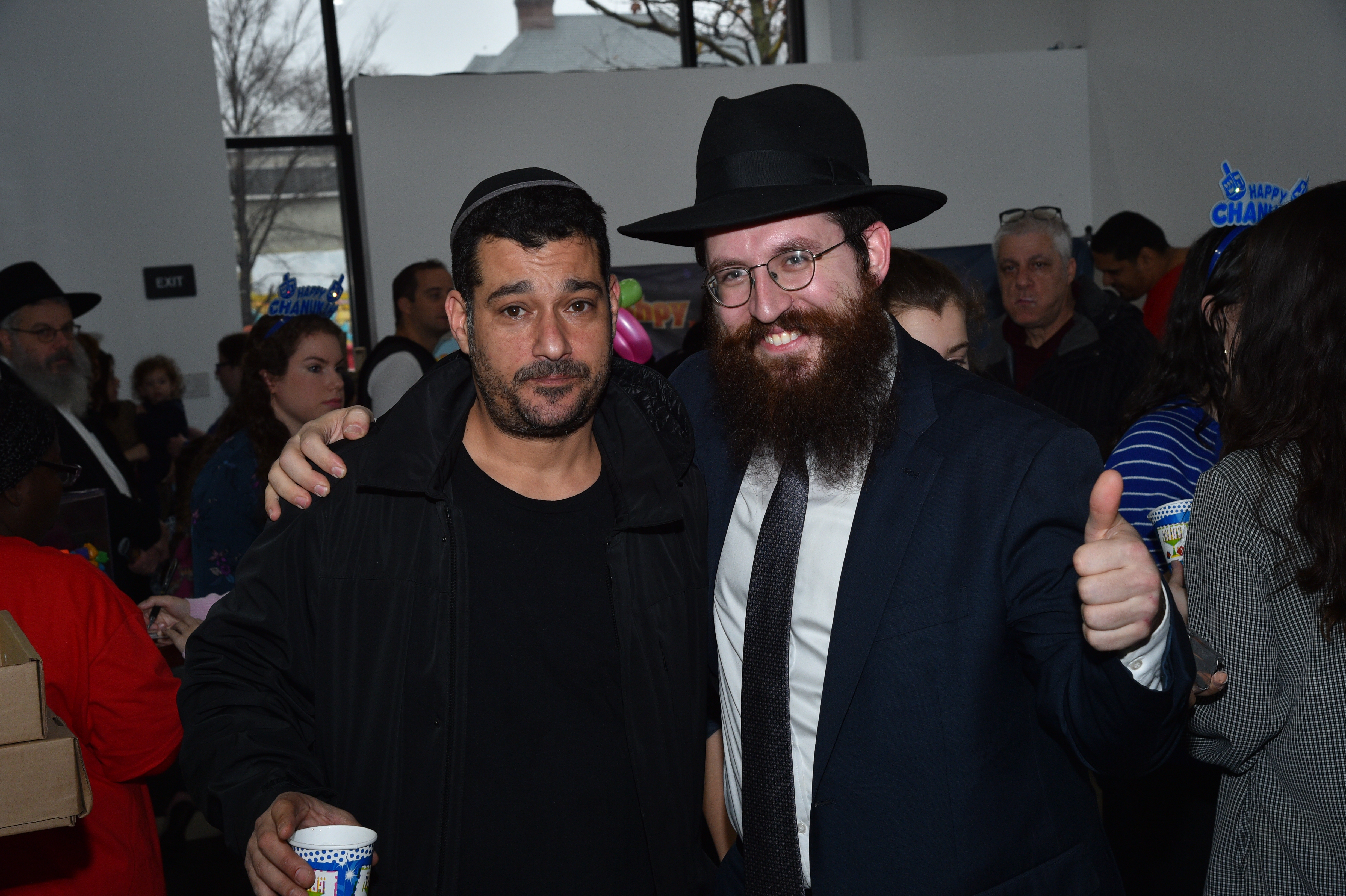 An attendee with Rabbi Yehuda Levin. Photos courtesy of Central Brooklyn Chabad