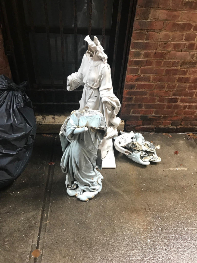 Andrew Oshevsky is accused of breaking this statue and one other after urinating on the angels outside a Williamsburg church. Photo courtesy of the NYPD