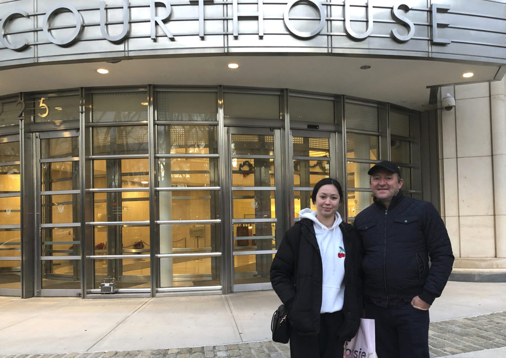 In this Dec. 3, 2018 photo, Australian tourists Wayne Burg and his daughter Lydia stand in front of Brooklyn’s federal court, in New York, where they were attending trial of Joaquin “El Chapo” Guzman, in the Brooklyn borough of New York. Burg is a criminal lawyer in his home country and said he did not want to miss the chance to witness one day in the trial of “El Chapo.” (AP Photo/Claudia Torrens)
