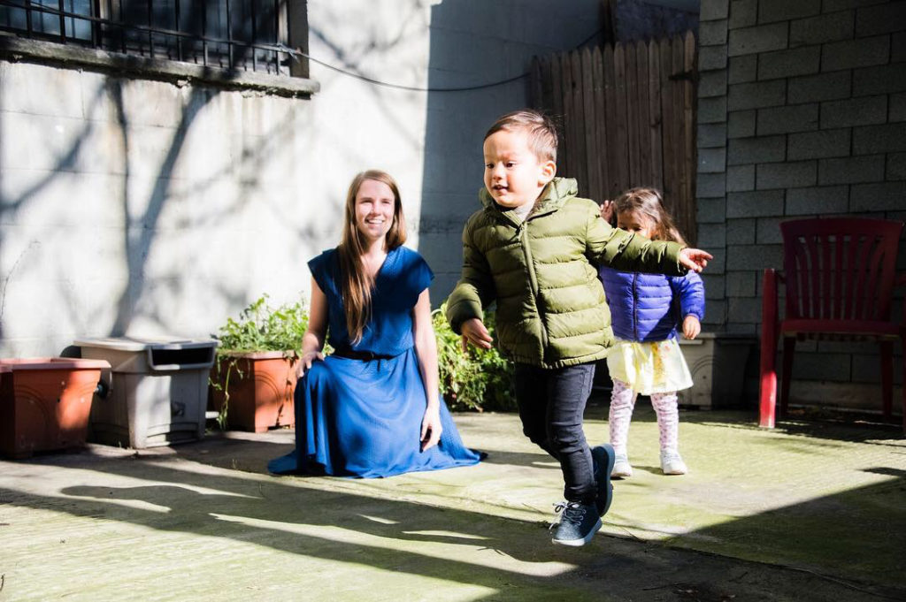 Kat Walker observes students as they play in the Greenpoint Montessori backyard. Photo courtesy of Greenpoint Montessori