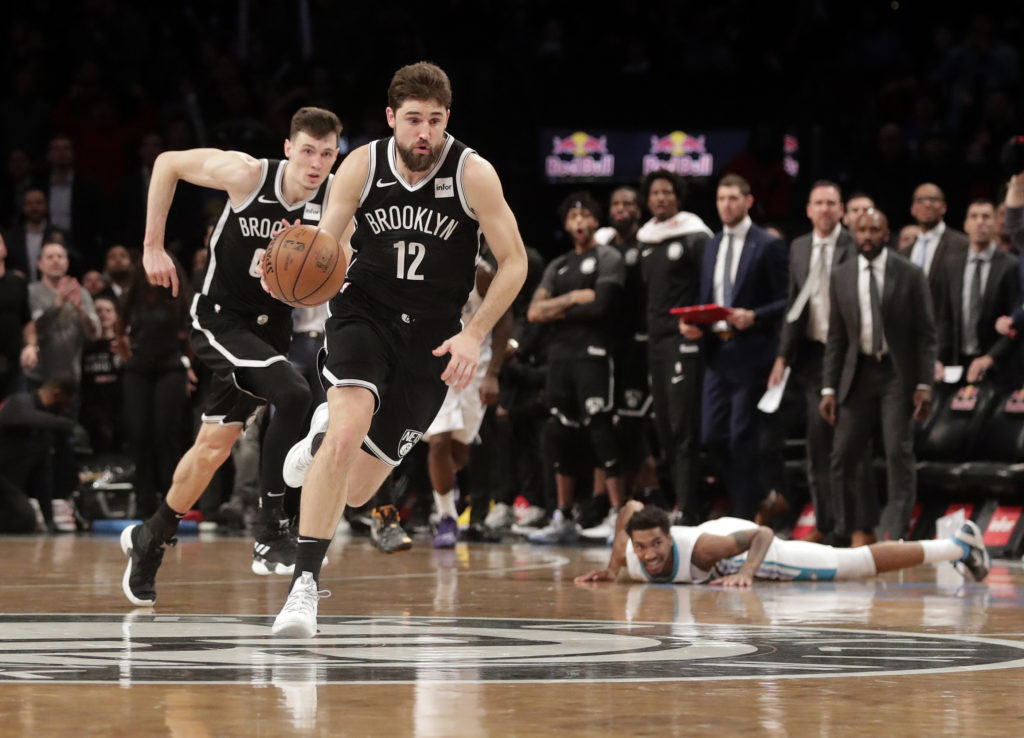 Joe Harris drives toward the winning basket Wednesday night during the Brooklyn Nets’ heart-stopping double-overtime win against the Charlotte Hornets at Downtown’s Barclays Center. AP Photos by Frank Franklin II