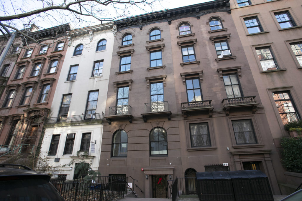 In this Dec. 10, 2018 photo, a brownstone apartment building, center, owned by Kushner Companies is shown in Brooklyn Heights. AP Photo/Mark Lennihan