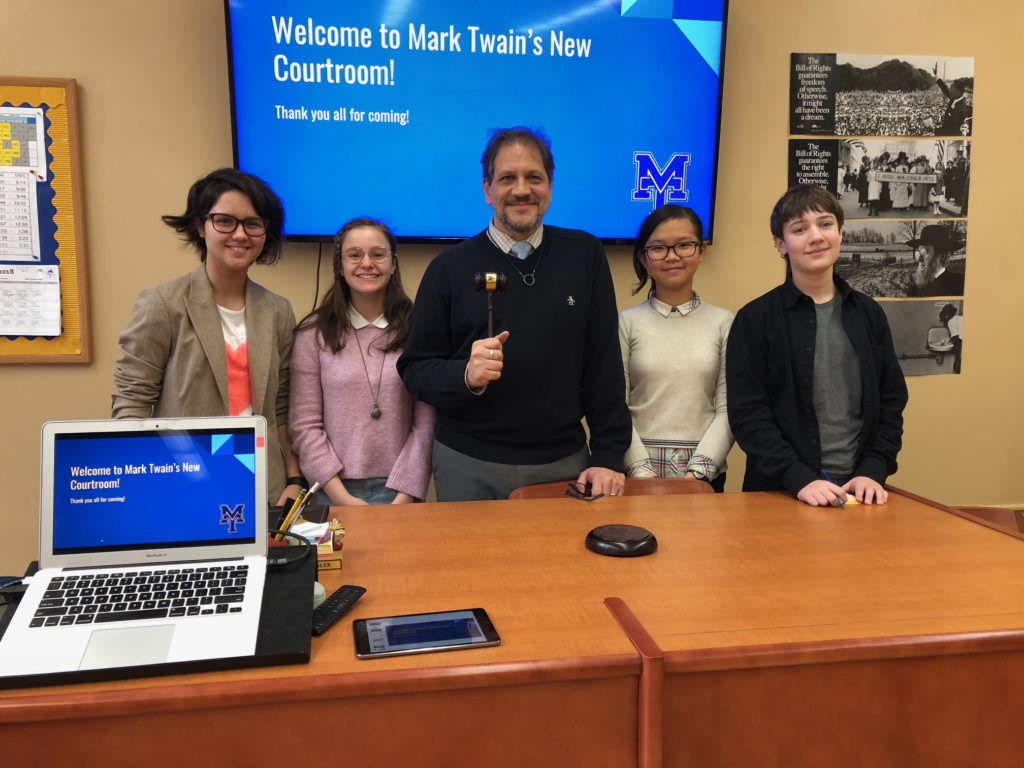 Law instructor Darren Kessler and four members of the Debate Team, Chloe Nudelman, Chiara Giardina, Kitty Wang and Victor Schacher (left to right) helped prepare the program for the ceremony. Eagle photos by Paula Katinas