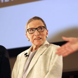 NPR's Nina Totenberg, left, and U.S. Supreme Court Justice Ruth Bader Ginsburg listen to Whitney W. Donhauser, president of the Museum of the City of New York, after participating in the David Berg Distinguished Speakers Series Saturday, Dec. 15, 2018 in New York. "The Notorious RBG" is now the subject of a second film about her this year — in theaters on Christmas Day. (AP Photo/Rebecca Gibian)
