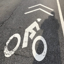 Transportation Alternatives leaders charge that there aren’t enough protected bike lanes in New York City. The bike lane logo pictured is located on the roadway on Sixth Avenue near 74th Street and is unprotected. Eagle photo by Paula Katinas