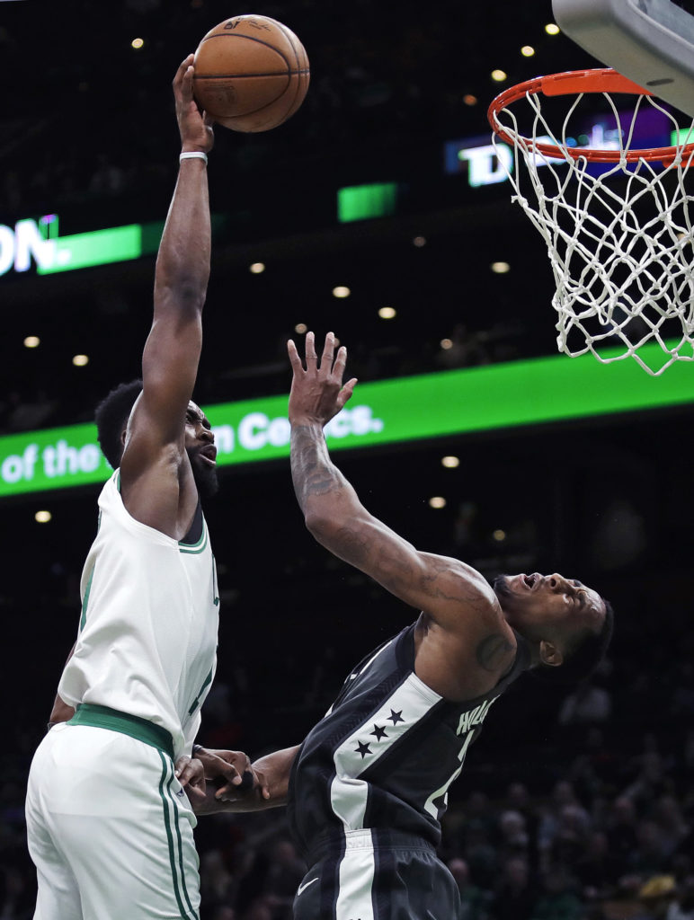 Jaylen Brown throws down two of his team high-tying 21 points Monday night in Boston, helping the Celtics cool off the injury-plagued Nets. (AP Photo/Charles Krupa)