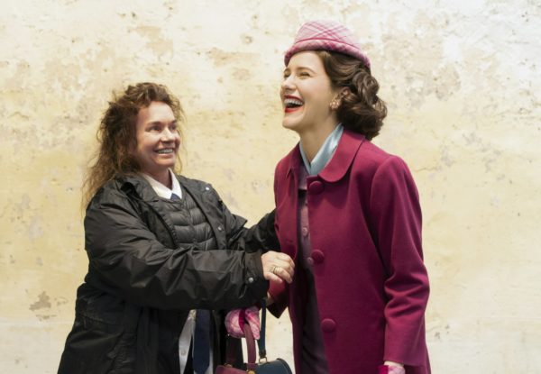 This image released by Amazon shows costume designer Donna Zakowska, left, with actress Rachel Brosnahan on the set of "The Marvelous Mrs. Maisel." On Thursday, Dec. 6, 2018, Brosnahan was nominated for a Golden Globe award for lead actress in a comedy series for her role in the series. The 76th Golden Globe Awards will be held on Sunday, Jan. 6. (Nicole Rivelli/Amazon via AP)
