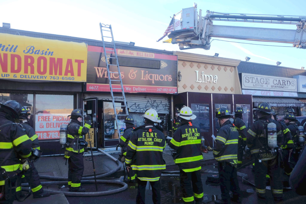 Firefighters battle a 2-alarm fire in a strip mall in Mill Basin Eagle photos by Todd Maisel