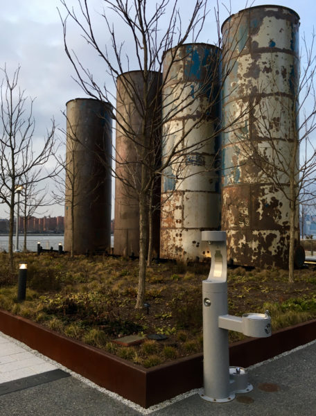 Salvaged syrup tanks stand tall in Domino Park.
